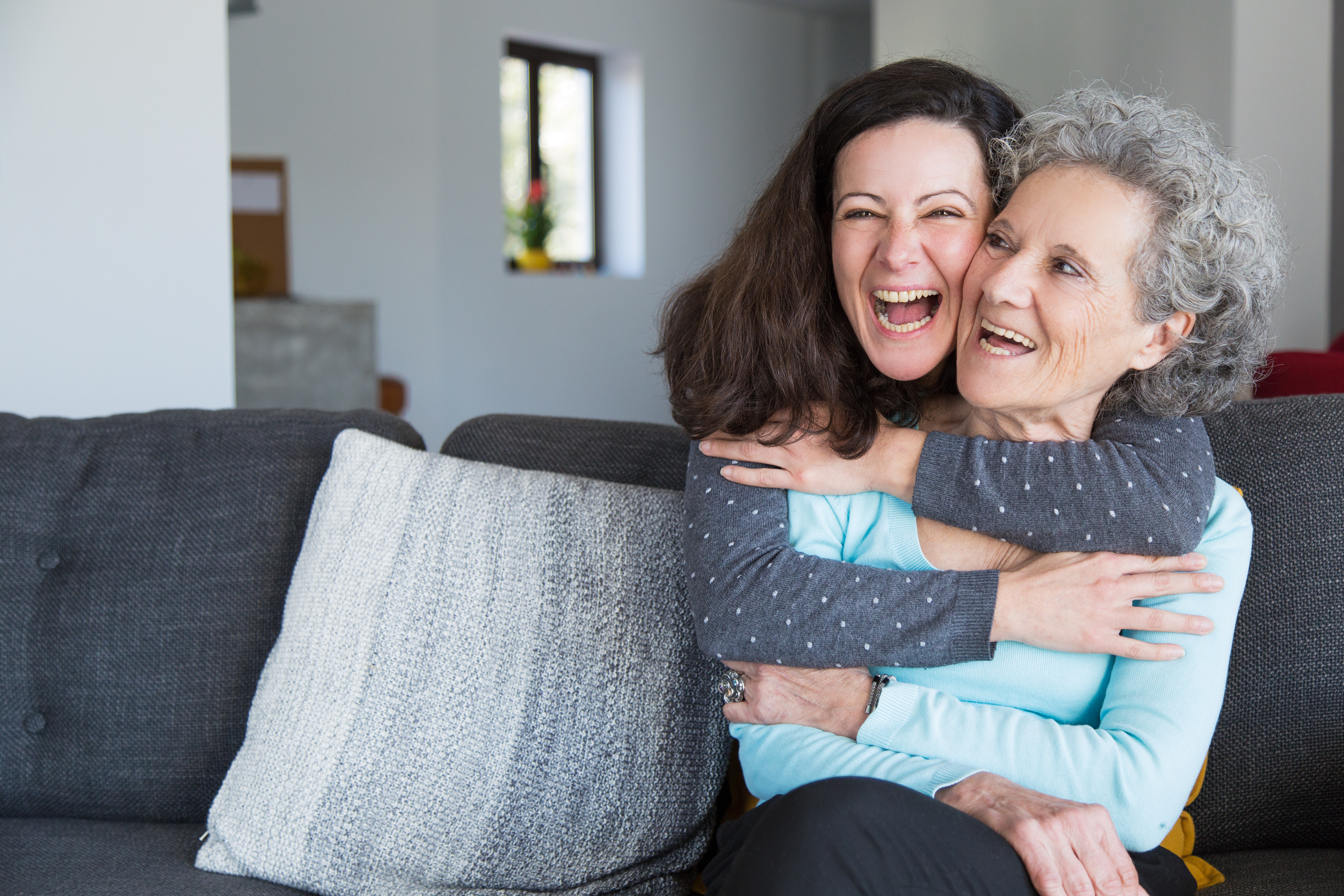 Portrait Happy Mid Adult Woman Embracing Her Senior Mother (1)